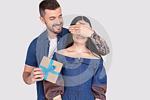 Close up photo amazing lady guy hide eyes guess who game prepared romance surprise hold big giftbox wear casual jeans denim shirts