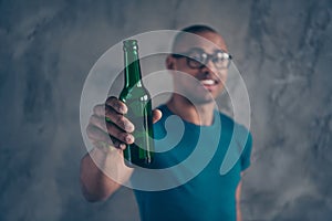 Close up photo amazing stunning he him his dark skin macho hangover toothy hand arm hold glass ale cider beverage