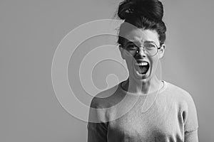 Close-up photo of anger young woman screaming