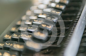 Close up photo of antique typewriter keys, focus on 6 key