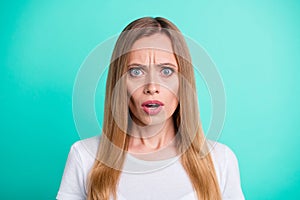 Close up photo of astonished person with opened mouth wonder wearing white t-shirt isolated over teal background