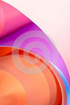 A close-up photo is a background of multicolored arcs with a gradient