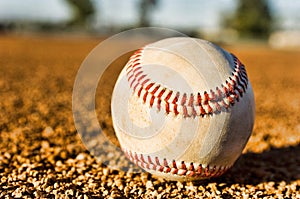Close-up shot of Baseball in Infield photo