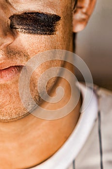 Close up photo of Baseball Player Wearing Eyeblack