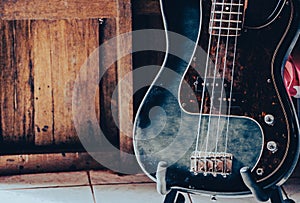 Close up photo of bass guitar or electric bass is the string instrument.