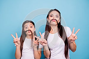 Close up photo beautiful two people brown haired mom small little daughter make funky moustache curls like guys man male