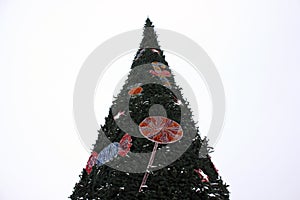 Close-up photo of a beautifully decorated large Christmas tree