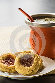 close up photo of a breakfast, a mate to drink and some biscuits or pepas to eat