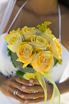 Close-up photo of Bride With Yellow Rose Bouquet