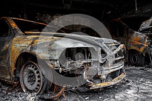 Close up photo of a burned out cars