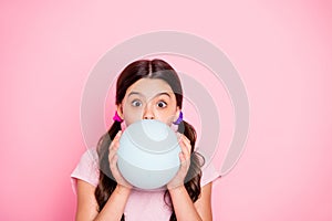 Close up photo of charming kid holding white baloon inflate wearing t-shirt  over pink background