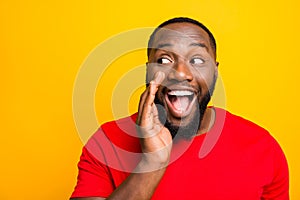 Close up photo of cheerful positive playful man telling someone secrets of him announcing important information while photo