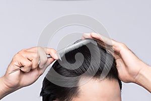 Close up photo of clean healthy man`s hair. Young man comb his h