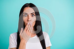 Close up photo of crazy girl in stupor hearing incredible bad fake news covering her mouth with hand isolated vivid teal