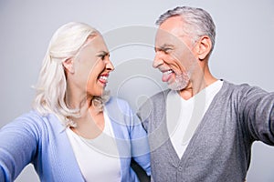Close up photo of crazy happy mad old people, they are taking a
