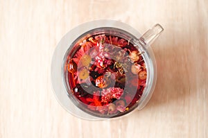 Close up photo of cup of hibiscus tea on the table in the morning