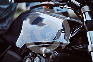 Close-up photo of a custom-made motorcycle fuel tank with sensors.