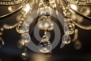 close up photo of of the details of a crystal chandelier in a hall photo