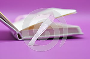 close up photo - diary on purple background