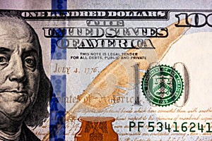 Close-up photo of dollars. Highlighted the new hundred dollar bill. Money background, Us currency USD