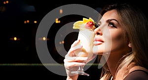 Close up photo of dreaming woman with sensual lips and mouth drinking cocktails. Cocktail menu. Cocktail for young. Bar