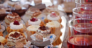 Close up photo with drings and candys on festive table