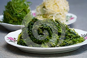 A Close up photo of the fresh seaweed on a plate. In Bali, its called bulung