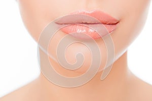 Close up photo of full woman`s lips after augmentation