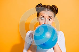 Close up photo of funky childish cheerful lady impressed by size of ballon for festivals carnivals celebration