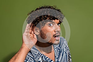 Close up photo of funny unshaved indian man hearsay listening secret information about war with pakistan isolated on photo