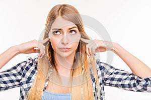 Close up photo of girl closing her ears