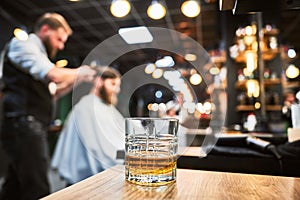 Close-up photo of a glass of whiskey.