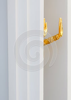 Close-up photo of golden Buddha's hand