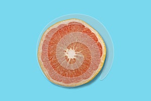 Close up photo of grapefruit on sea green background with copy space