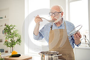 Close up photo grey haired he his him grandpa appetite waiting guests cooking favorite family dish trying taste wait