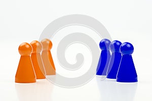 Close-up photo of a group of different-colored pieces in different positions on a white background