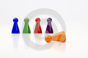 Close-up photo of a group of different-colored pieces in different positions on a white background