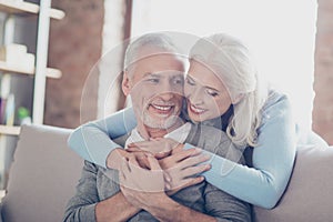 Close up photo of happy joyful beautiful couple of old people who give to each other so warm hugs