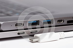 Close-up photo of laptop type-c port, type-c hub and type-c cable photo
