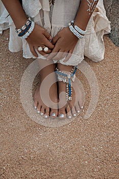 Close up photo of legs with stylish anklets