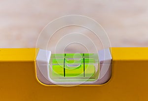 Close up photo of a leveling tool bubble level being used