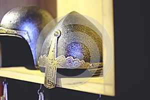 Close-up photo of medieval helmet , ancient warrior iron knight shining style . Concept of old vintage traditions , extreme fight