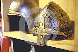 Close-up photo of medieval helmet , ancient warrior iron knight shining style . Concept of old vintage traditions , extreme fight