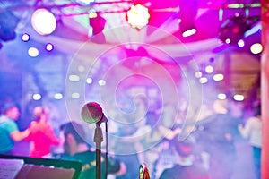 Close-up photo of a microphone in the night club.