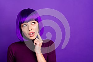 Close up photo of minded person looking up touching her chin having thoughts wearing turtleneck  over purple