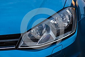 Close up photo of modern and clean car, detail of headlight. Headlight car Projector/LED of a modern luxury technology and auto