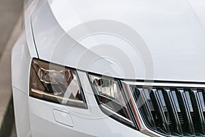 Close up photo of modern and clean car, detail of headlight. Headlight car Projector/LED of a modern luxury technology and auto