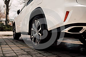 Close up photo of modern luxury sport car suv elegant design mufflers tailpipe.