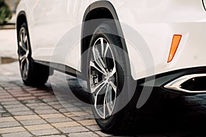 Close up photo of modern luxury sport car suv elegant design mufflers tailpipe. photo