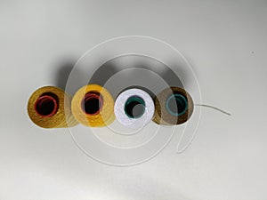 Colorful Spools of Sewing Thread on White Background